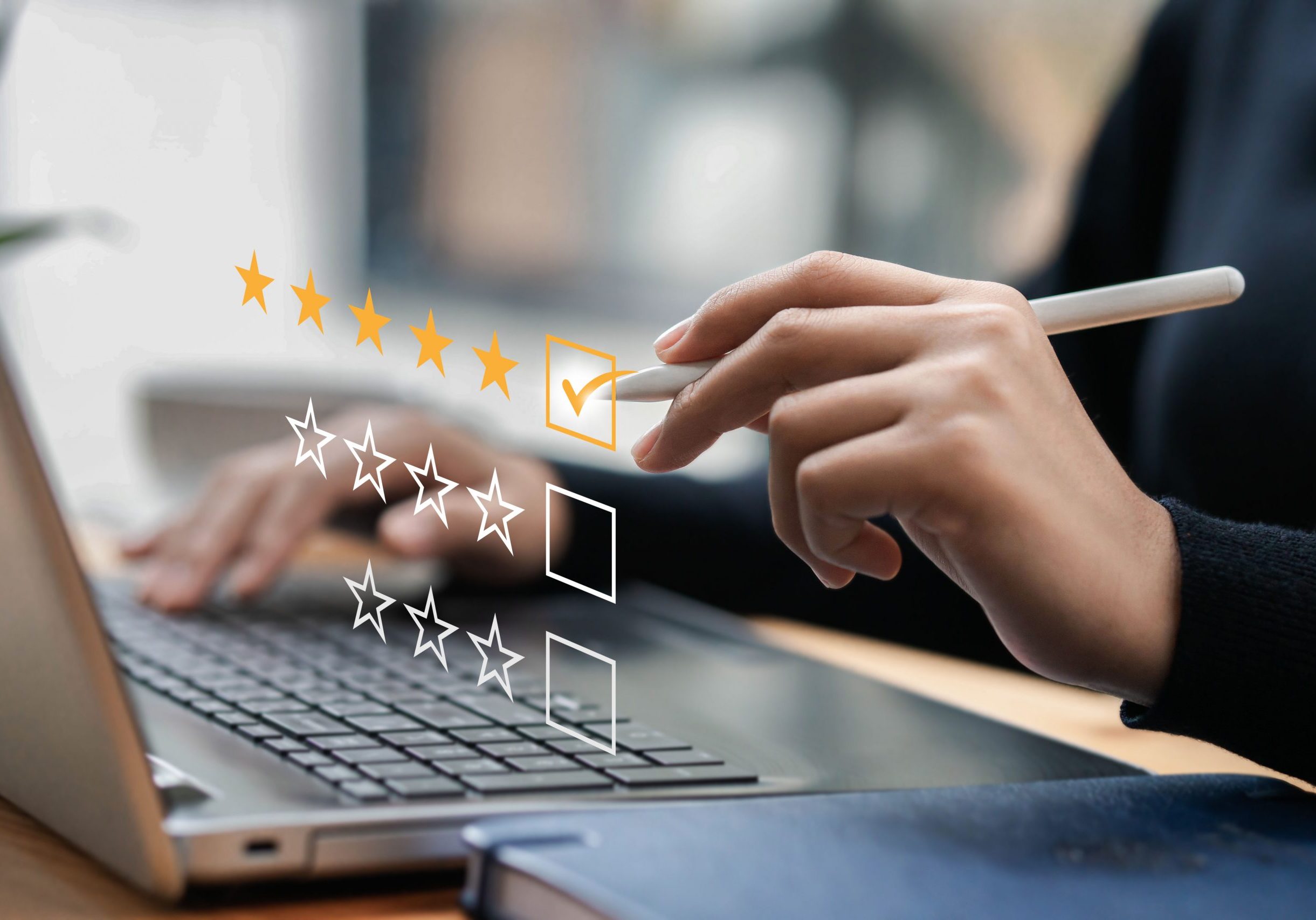 Businessman typing on a computer keyboard, customer service satisfaction survey concept. Business people choose the highest satisfaction rating and give 5 stars. Satisfaction, rating, rating.